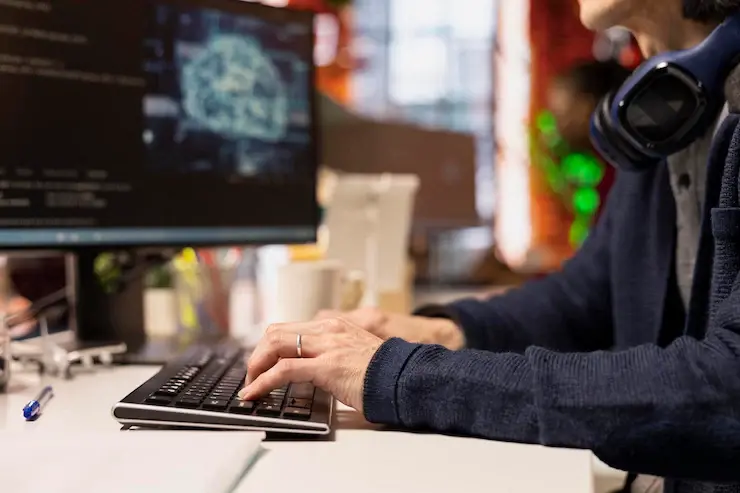 Students working on computers with coding screens and tech career symbols in background